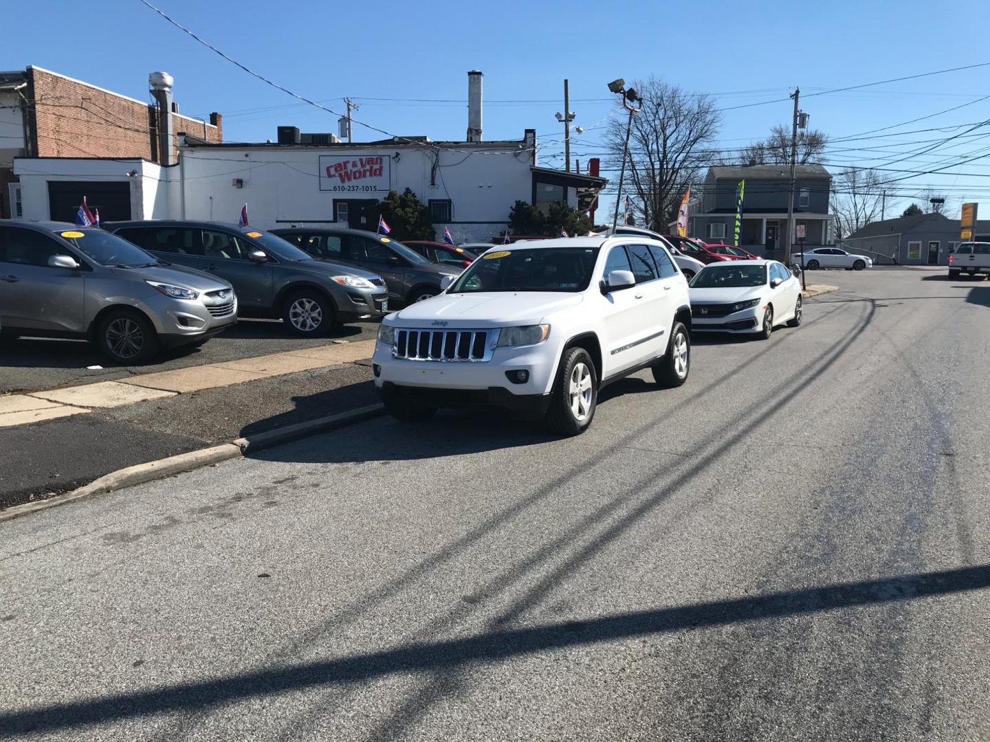 2013 White /Tan Jeep Grand Cherokee Laredo (1C4RJFAG6DC) with an 3.6 V6 engine, Automatic transmission, located at 577 Chester Pike, Prospect Park, PA, 19076, (610) 237-1015, 39.886154, -75.302338 - Photo#1